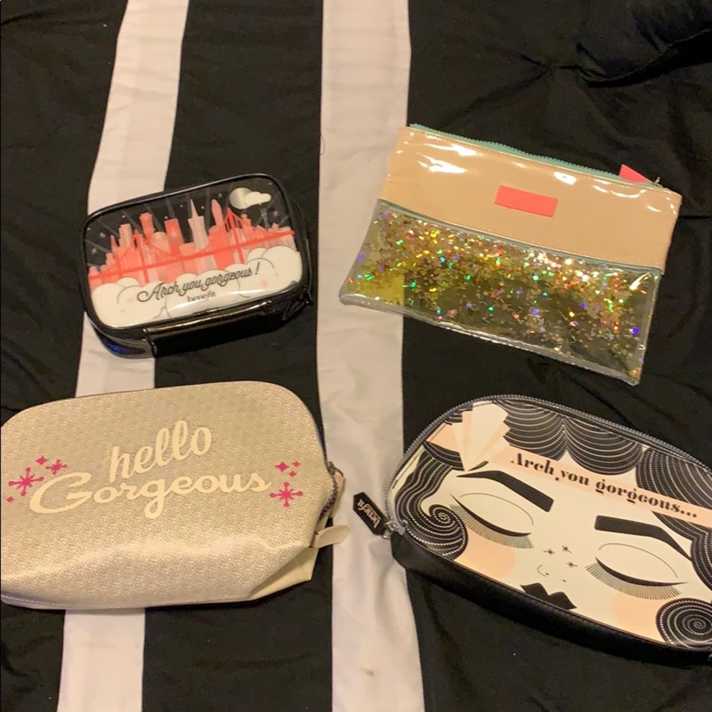 4 piece Benefit Cosmetics makeup bags